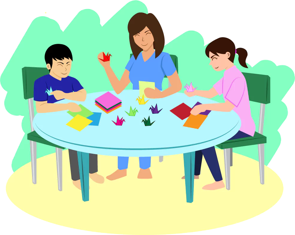 Two children and their support worker doing paper crafts